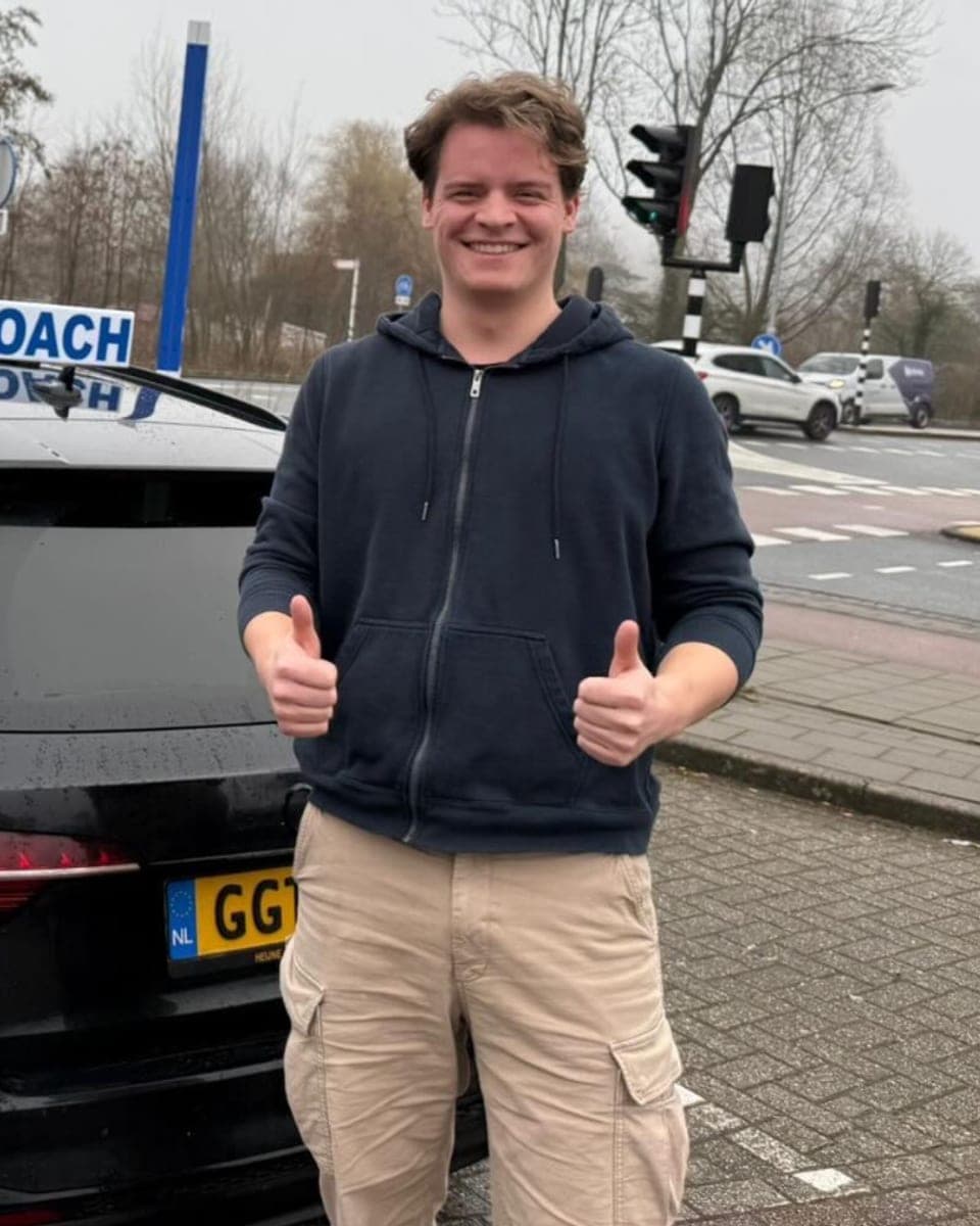 Rijcoach student celebrating after passing the driving test in Haarlem